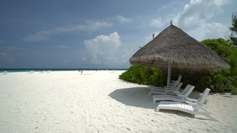 Static shot of a group of beach chairs u... | Stock Video | Pond5