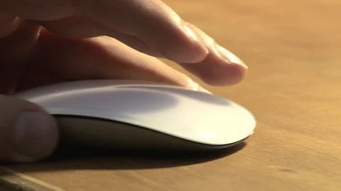 Static shot of a hand moving and clicking a mouse Stock Footage 92525471
