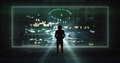 Static shot of hooded hacker in front of a gigantic digital video wall Stock Footage 129502229