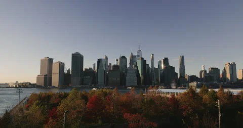 Static shot of iconic view of Manhattan from Brooklyn Bridge Park. Autumnal Stock Footage 264779813