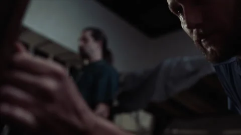 Static shot of inmates watch as guards search a cell, 2000s, USA - Reenactment 스톡 동영상 243736256