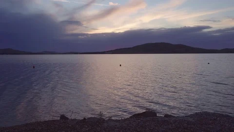 Static shot of a lake at sunset. Video stock 119070273