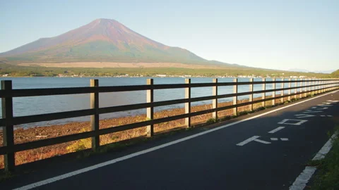 Static shot of lakeside path beside Lake Yamanaka facing Mount Fuji Stock Footage 321122640