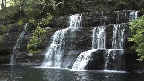 Static shot of large Welsh waterfall (Sgwd y Pannwr) Stock Footage 92576428