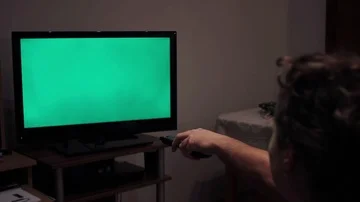 A static shot of a man's hand changing channels  Stock Footage 85570980