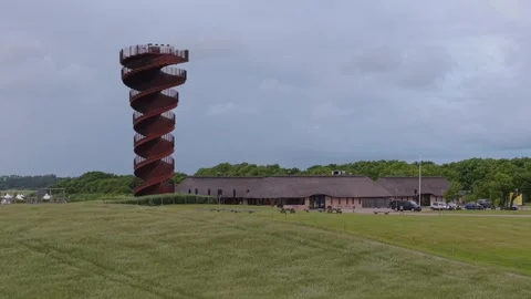 Static Shot of Marsk Tower as Wind Creates Unique Patterns Across the Marsh Stock Footage 346257647