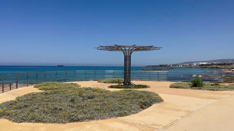 Static shot of a metal sunshade installation on a coastal promenade Stock Footage 336320551