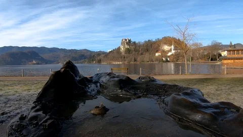 Static shot miniature copper city model at lake Bled with castle on rock Stock Footage 123168355