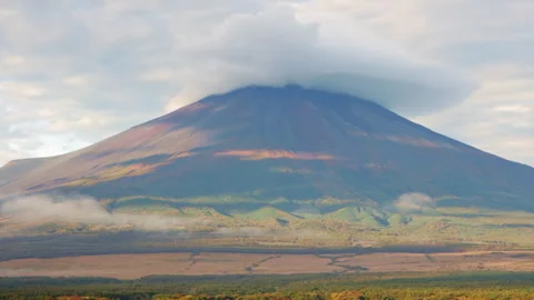 Static shot of Mount Fuji with cloud cap in warm morning light Stock Footage 321125417