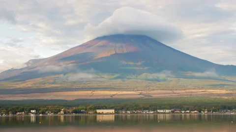 Static shot of Mount Fuji with cloud cap above Lake Yamanaka in morning light Stock Footage 321125515