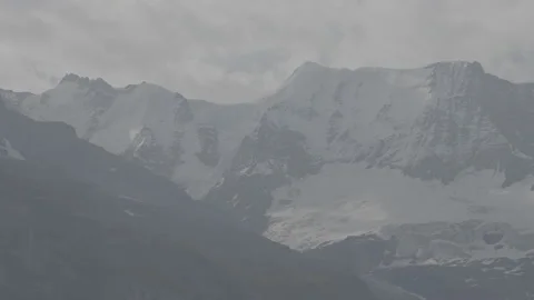 Static shot of mountains covered in snow, clouds moving, slog3 Stock Footage 166616644