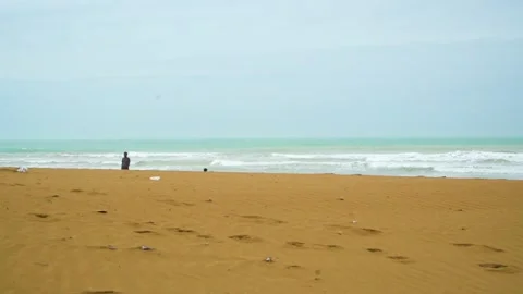 Static shot of the ocean with calm waves reaching the shore of a white sand  Stock Footage 284444843