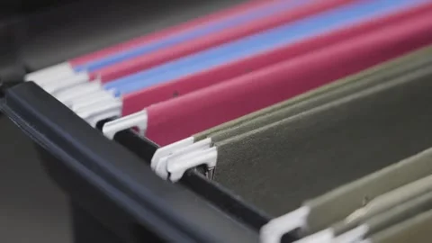 Static shot of organizational files in a cabinet. Stock Footage 331702177