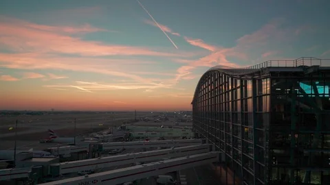 Static shot overlooking Heathrow airport during sunrise Stock Footage 100444130