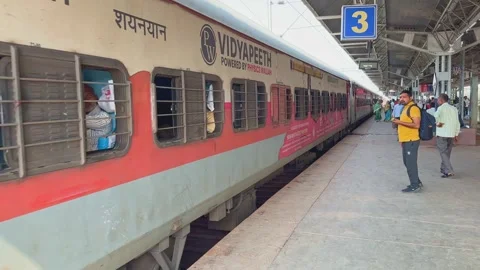 Static shot of passenger sleeper train stopping at station Stock Footage 296790114