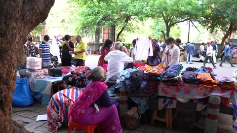 Static shot of people buying clothes at New Delhi, India Stock Footage 166345100