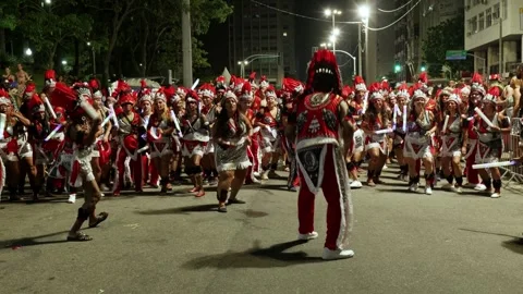 Static shot of performers dancing in costume during a Rio de Janeiro Carnaval Stock Footage 336037311