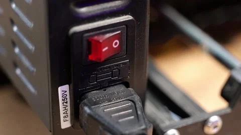 Static shot of a person pressing the power switch to the on and off positions Video stock 336961067