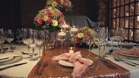 Static shot of place settings with candles and pink napkin Stock Footage 160829771