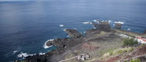 Static shot of Ponta da Ferraria a calm shot of the ocean, waves crashing Stock Footage 320074064