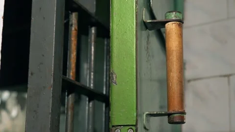 Static shot of the prison cell doors with moving light. Stock Footage 303553020