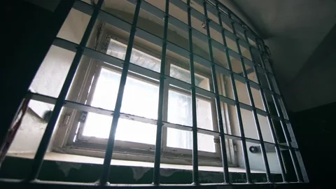 Static shot of the prison cell window with bars. Stock Footage 303552573