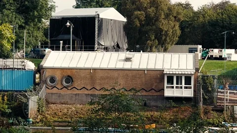 Static shot of red brick building across a river. Stock Footage 160436668
