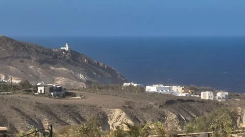 Static Shot of Santorini Landscape on Windy Day with Lighthouse. Stock Footage 334547813
