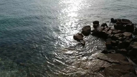 Static shot of sea coming through rocks Stock Footage 106780650