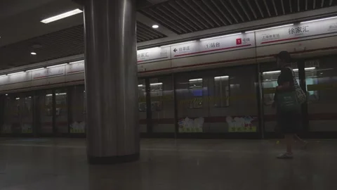Static Shot of Shanghai Metro Train Departing Station Platform Video stock 346968872
