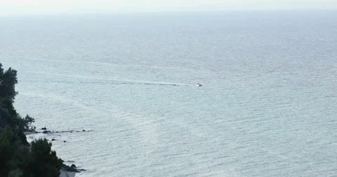 Static shot of small boat sailing in the sea Stock Footage 197642189