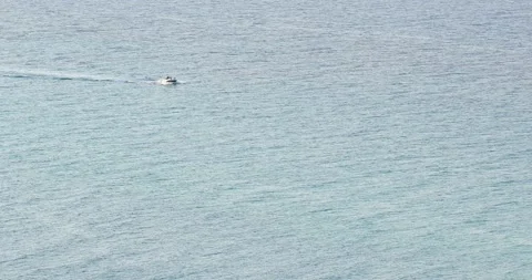 Static shot of small boat sailing in the sea Stock Footage 197645320