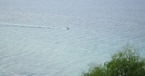 Static shot of small boat sailing in the sea Stockbeeldmateriaal 197645419