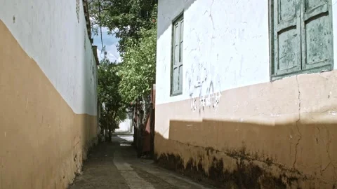 Static shot of small town street alley in Colombia Stock Footage 153801742