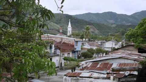 Static shot of small tropical rural town and church Stock Footage 153801808