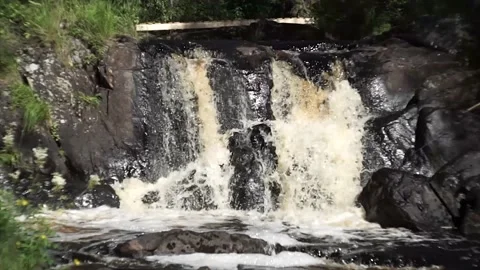 A static shot of a small waterfall. Stock Footage 150108593