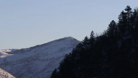 Static shot of snow-covered mountain peak in the background. Stock Footage 217526274