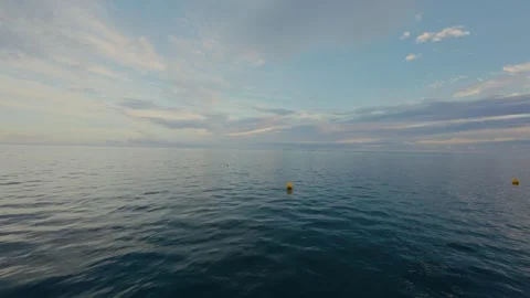 Static shot of south pacific lagoon at sunrise with buoys Stock Footage 307166629