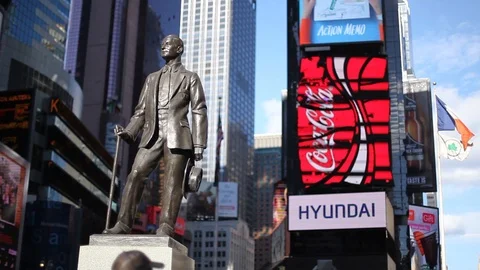 A static shot of the statue of George M Cohan in Times Square Stock Footage 87341234
