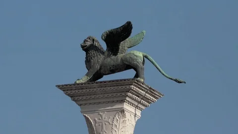 Static shot of statue of the Lion of Saint Mark on its column in St Marks Square Stock Footage 83361601