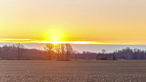 Static shot of sun rising over yellow sk... | Stock Video | Pond5