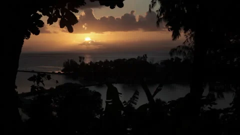Static shot of sunset over ocean and lan... | Stock Video | Pond5