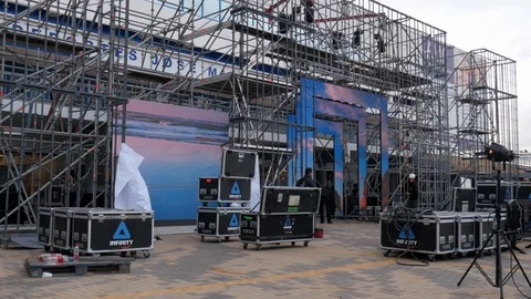 Static shot of the technical preparation of the stage of an outdoor event Stock Footage 123404300