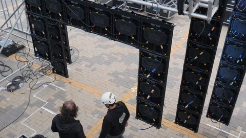 Static shot of the technical preparation of the stage of an outdoor event Stock Footage 123405318