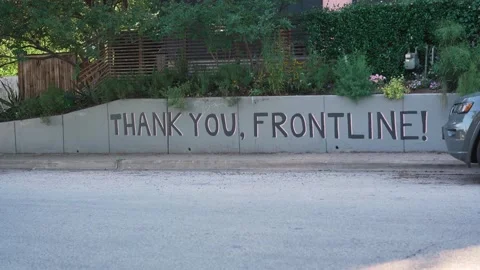 Static shot of Thank You, Frontline wall art mural in Austin, Texas while Stock Footage 131302974