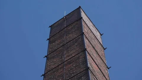 Static shot of the top of a large old industrial chimney stack 動画素材 158729608