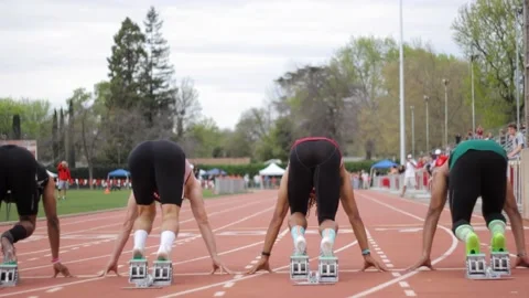 Static shot of track and field sprint race with a black man and white man Video stock 205101848