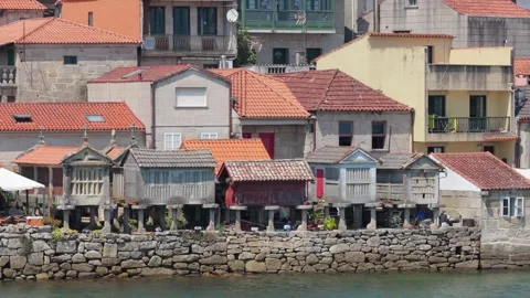 Static shot of traditional stone granaries, known as horreos, and old houses Stock Footage 346688459