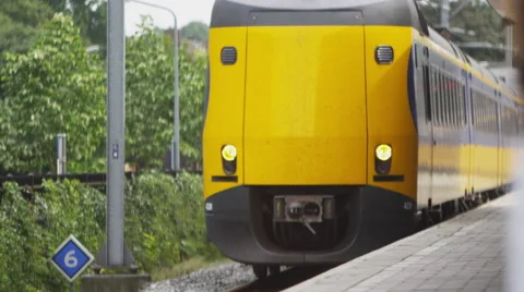 Static shot of train arriving at a train station in Amsterdam Stock Footage 52219438