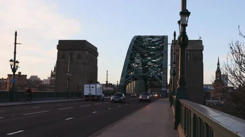 Static shot of Tyne Bridge in Newcastle with traffic, during golden hour Stock Footage